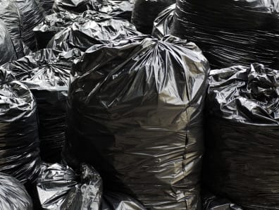 Black refuse sacks ready for removal